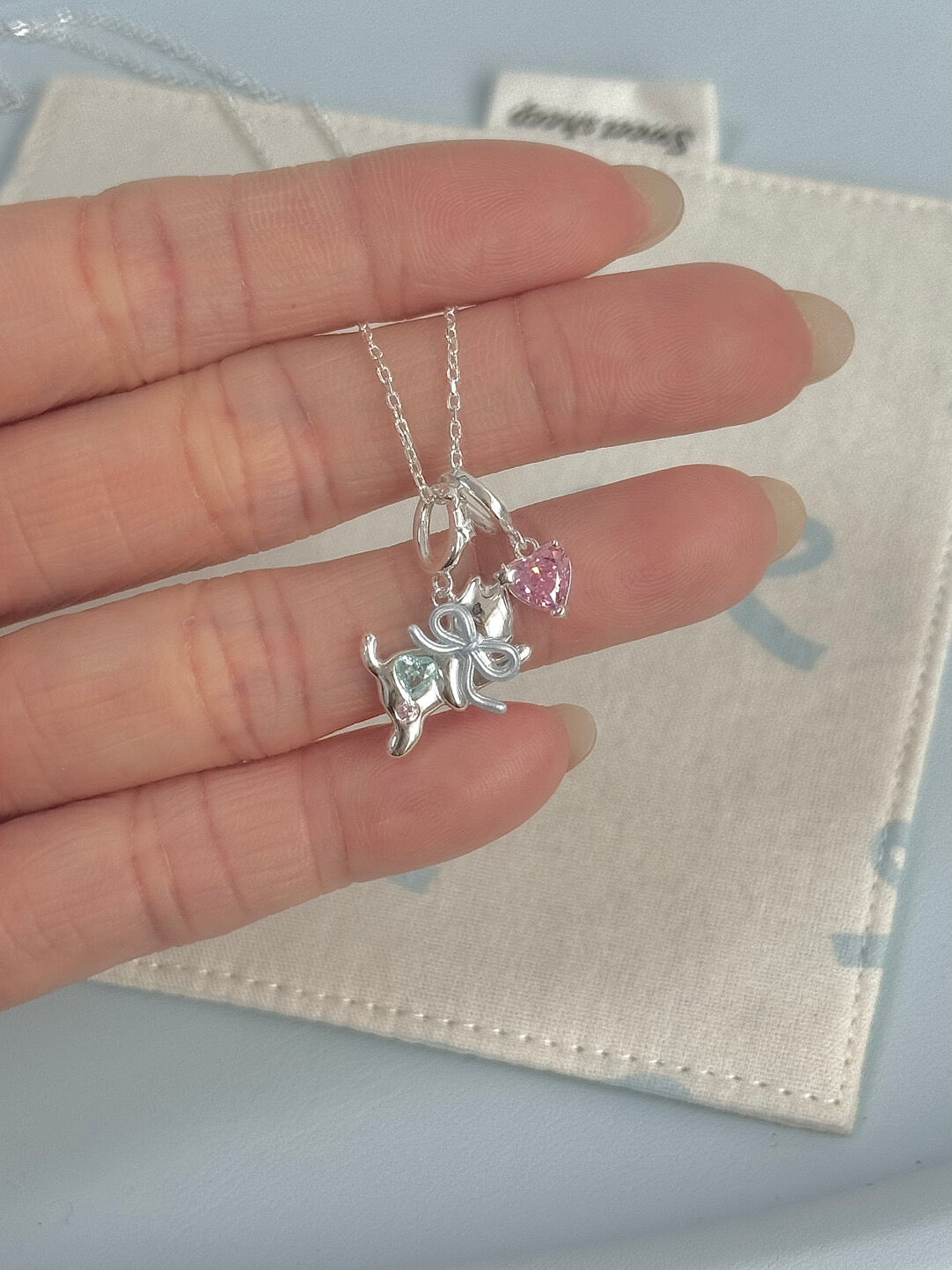 LolaWhite "Milky Paws" S925 Sterling Silver Pink Zircon Blue Bow Kitten Necklace