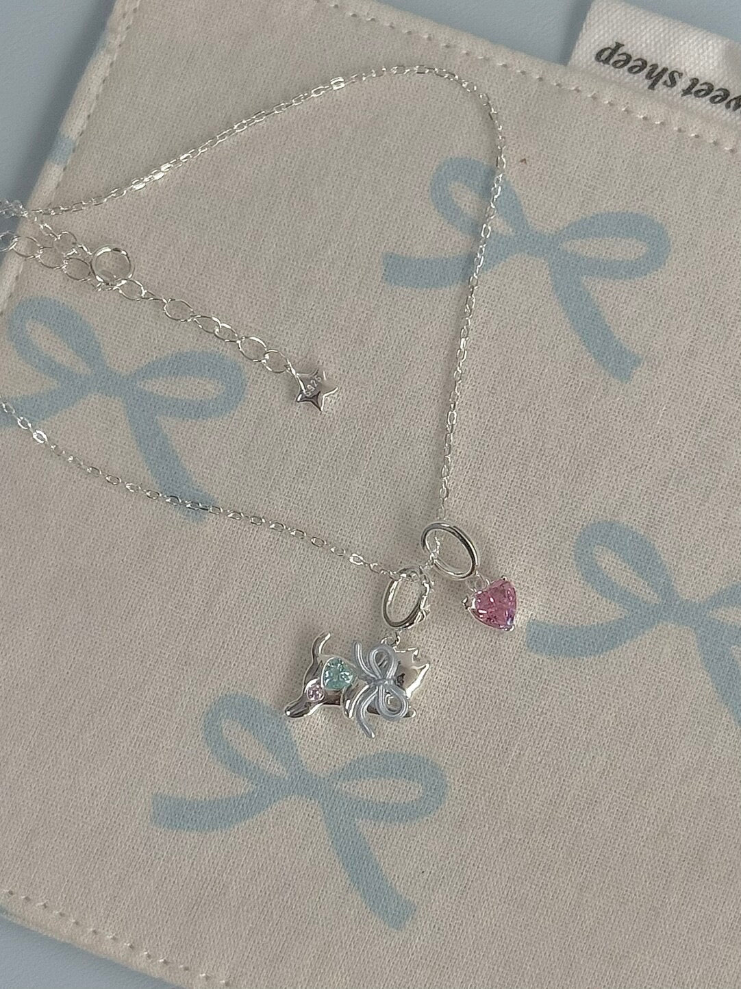 LolaWhite "Milky Paws" S925 Sterling Silver Pink Zircon Blue Bow Kitten Necklace