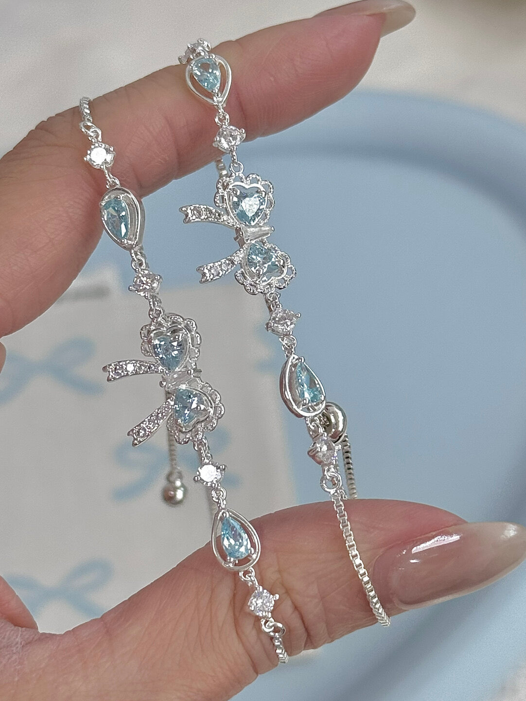 LolaWhite "Lingering Rainlight" Blue Zircon Lace Bow Bracelet – Silver Plated, Dazzling & Sweet