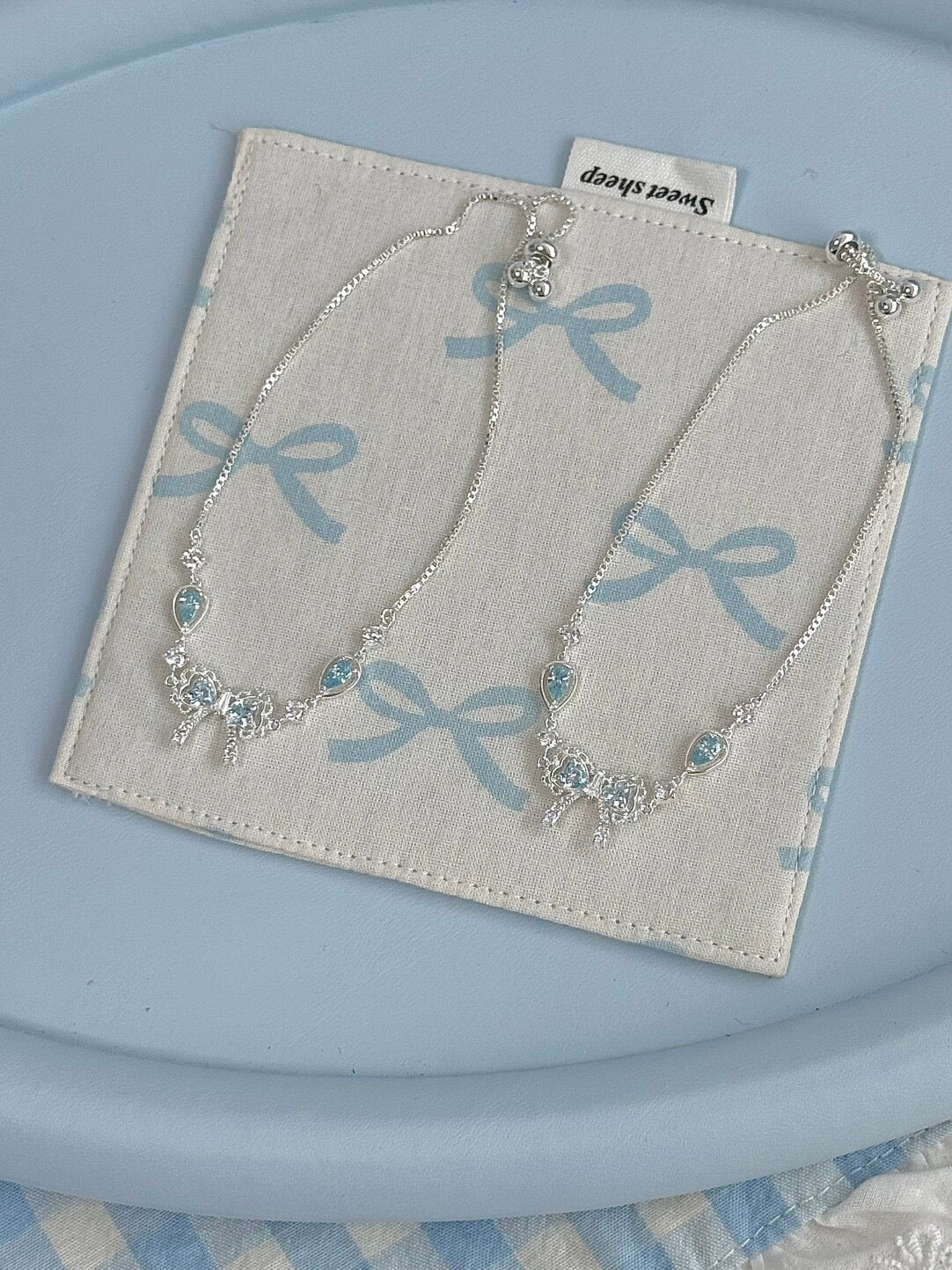 LolaWhite "Lingering Rainlight" Blue Zircon Lace Bow Bracelet – Silver Plated, Dazzling & Sweet