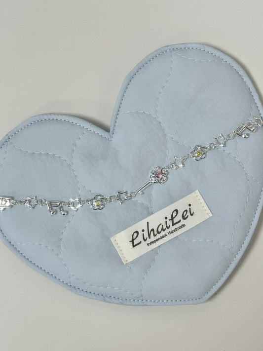 LolaWhite "Lucky Melody" S925 Sterling Silver Bracelet with Four-Leaf Clover, Key, Flower & Music Note Charms - Unique & Symbolic