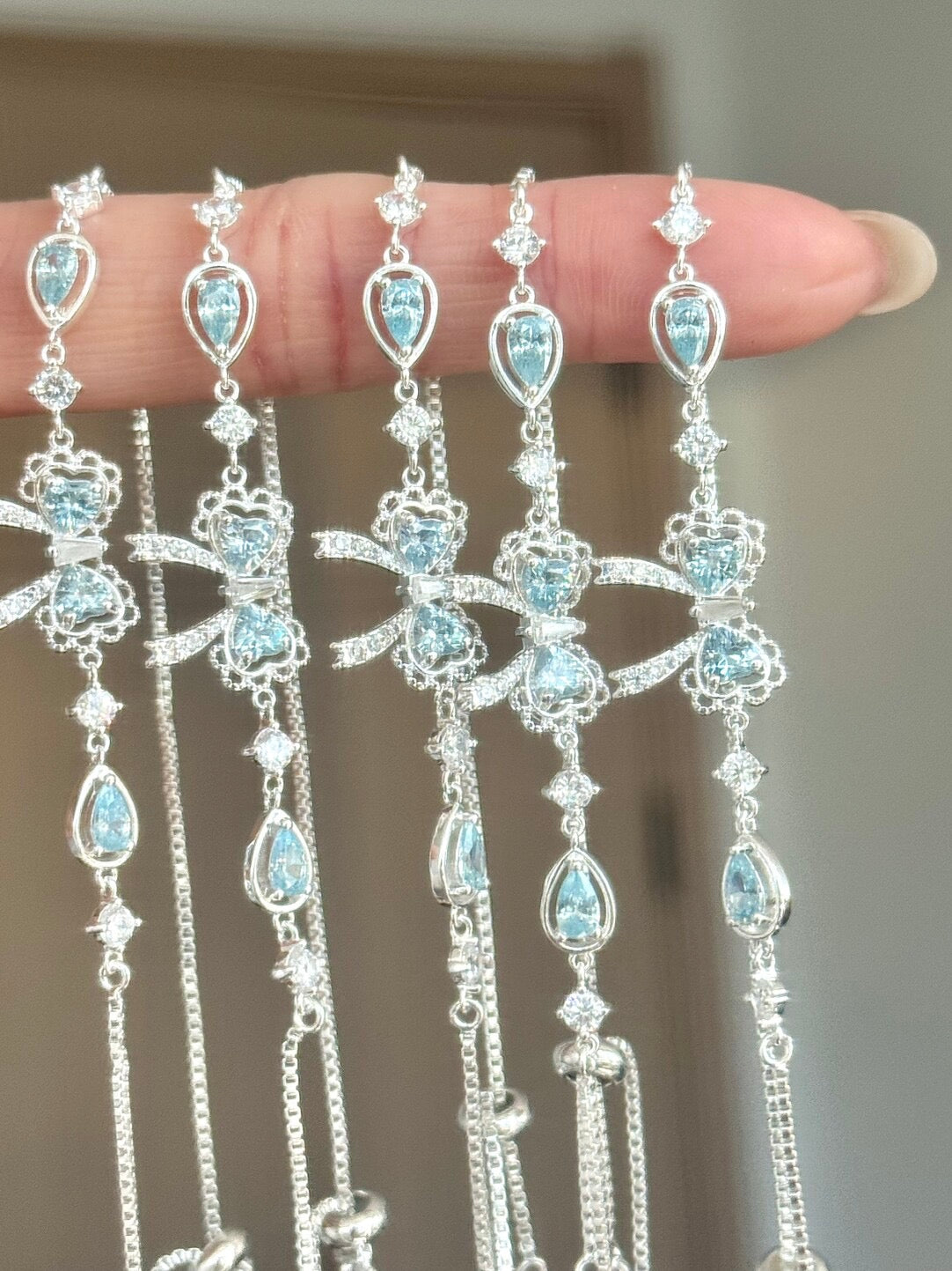 LolaWhite "Lingering Rainlight" Blue Zircon Lace Bow Bracelet – Silver Plated, Dazzling & Sweet