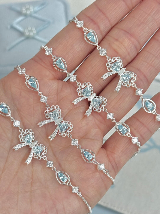 LolaWhite "Lingering Rainlight" Blue Zircon Lace Bow Bracelet – Silver Plated, Dazzling & Sweet