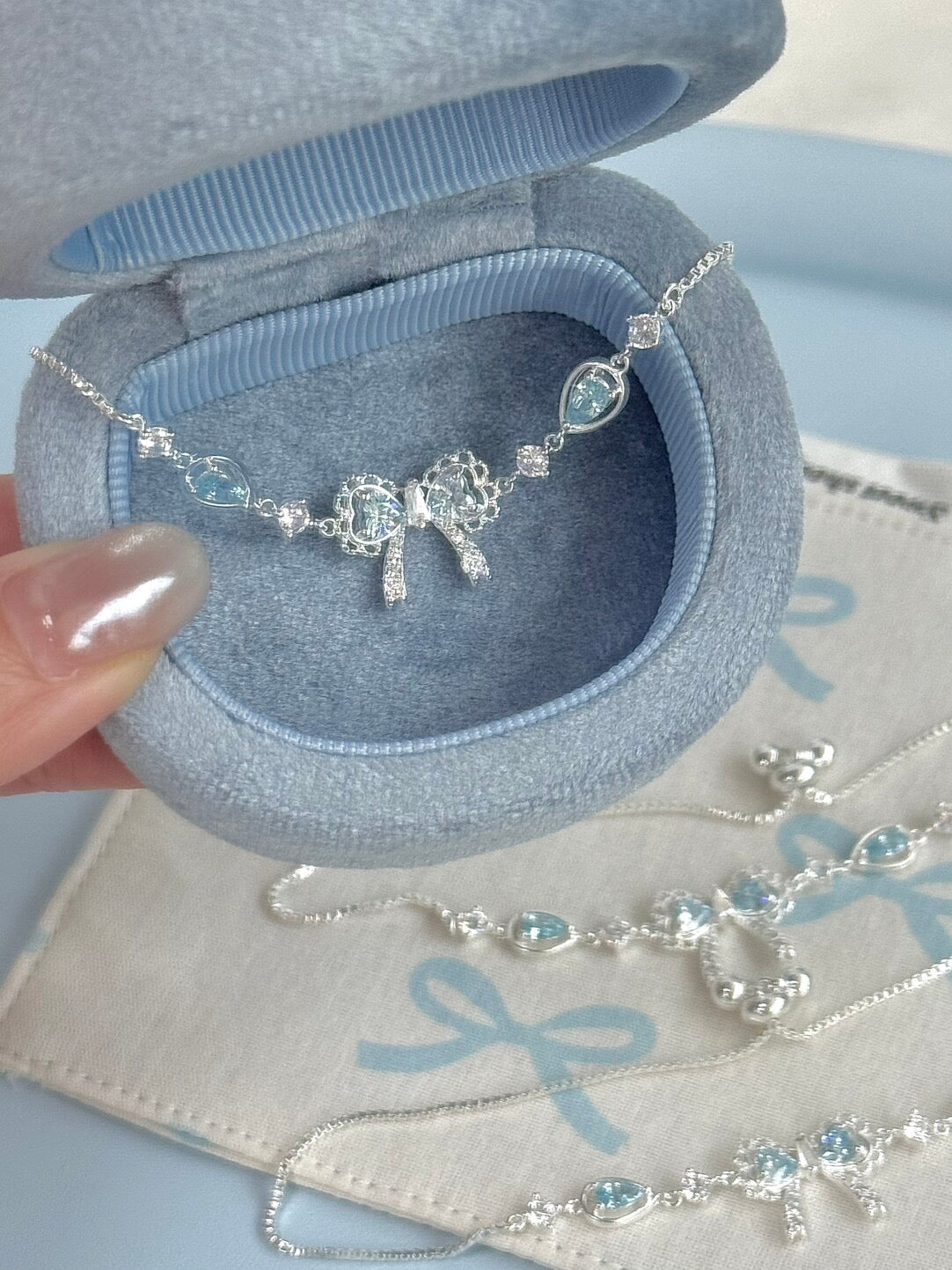 LolaWhite "Lingering Rainlight" Blue Zircon Lace Bow Bracelet – Silver Plated, Dazzling & Sweet