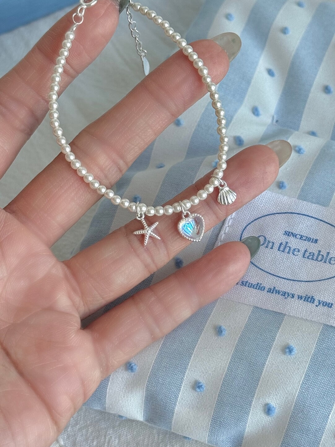 LolaWhite "Halo Lover" Solid S999 Pure Silver Iridescent Heart Bracelet with Starfish, Shell and Pearl Accents - Ethereal & Romantic